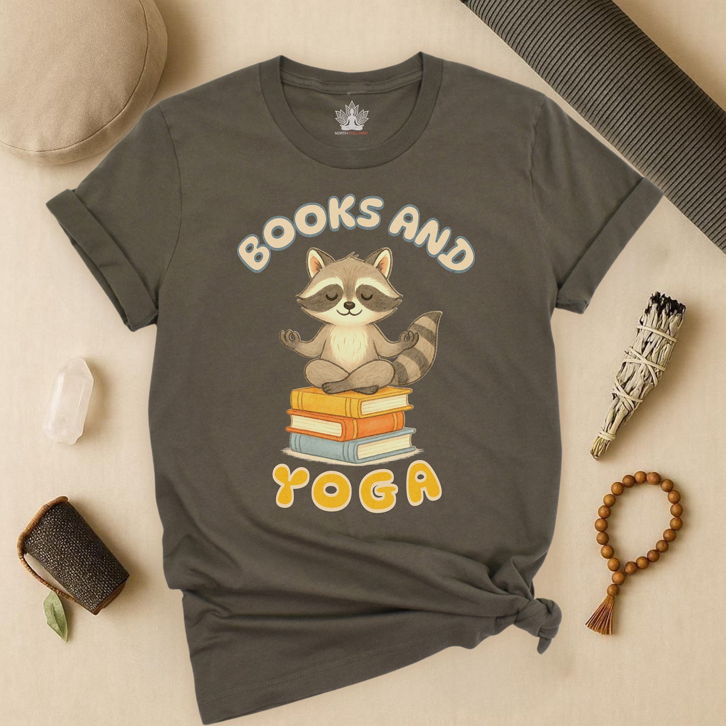 Books and Yoga – Cozy Raccoon Tee